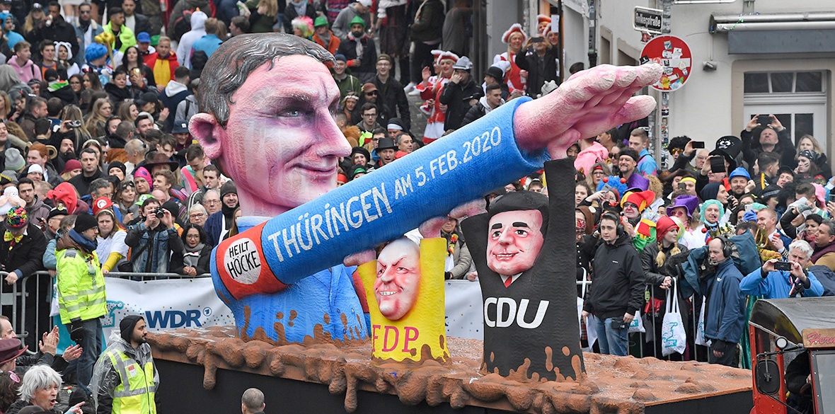 A carnival float, depicting far-right AfD politician Bjoern Hoecke, whose arm is raised by CDU and FDP politicians at the Thuringia elections, during the traditional carnival parade in Duesseldorf, Germany, on Monday, February 24 2020