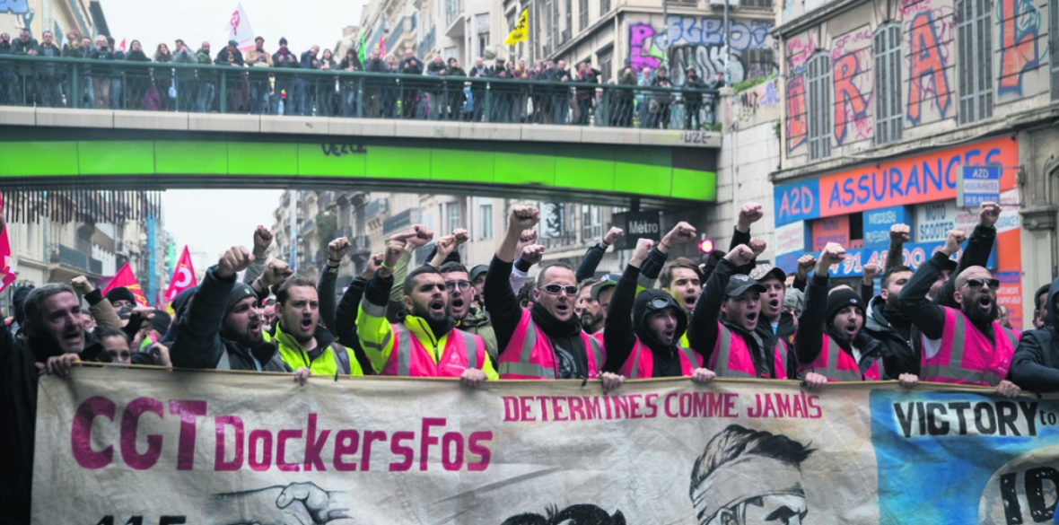 Dock workers and other trade unionists march in Marseille, France against Macron
