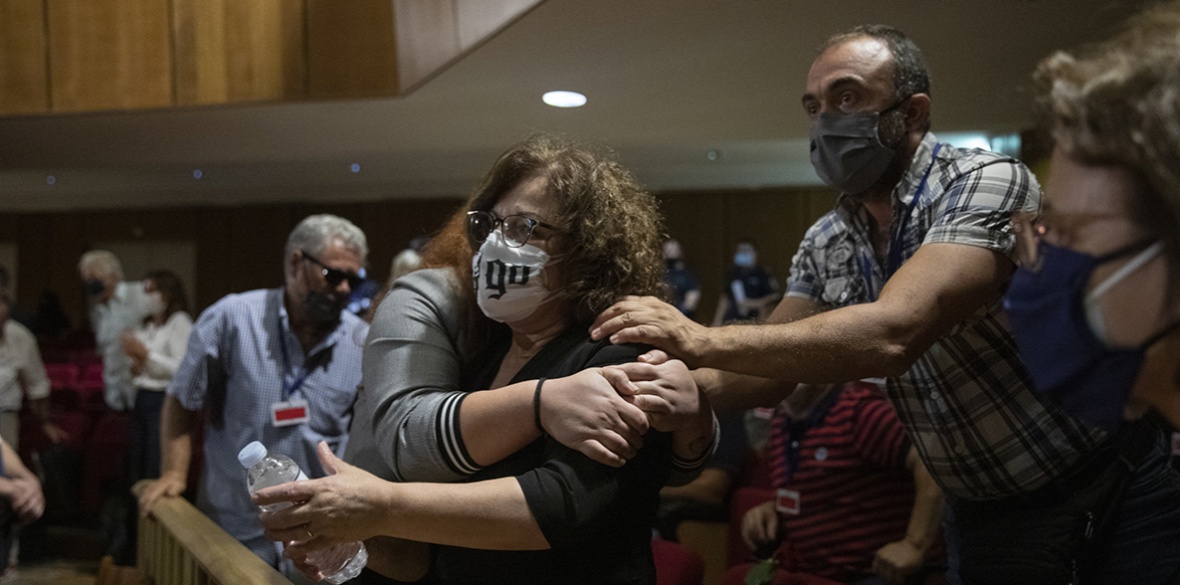 Magda Fyssa (centre) the mother of late Greek rap singer Pavlos Fyssas, who was stabbed and killed by a supporter of the extreme right Golden Dawn party in 2013 triggering a crackdown on the party, celebrates immediately after the delivery of the verdict of a court in Athens