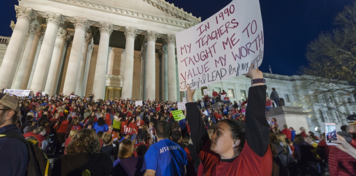 Striking teachers strike outside of the capitol building in Charleston, West Virginia