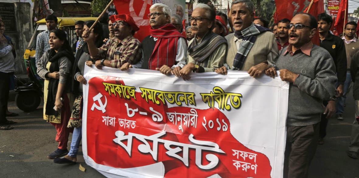 Communist Party of India-Marxist (CPI-M) supporters participate in a rally on the second day of a two-day general strike called by various trade unions in Kolkata