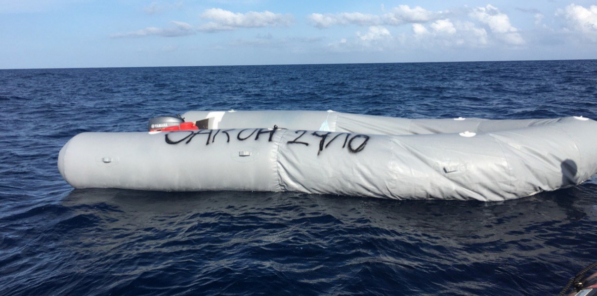 The remains of an inflatable rubber dinghy off Libya that was carrying 15 people, all of whom were rescued by rescue ship Open Arms
