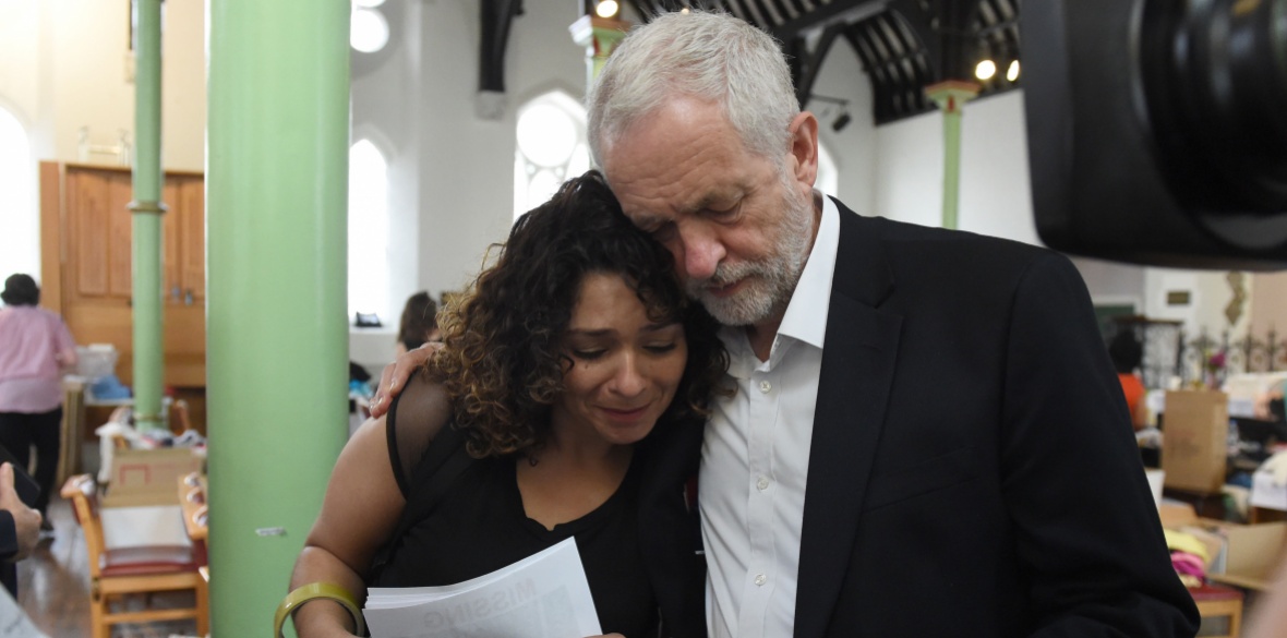 Jeremy Corbyn comforts a local resident last June at St Clement's Church in west London where volunteers provided shelter and support for people affected by the fire at Grenfell Tower