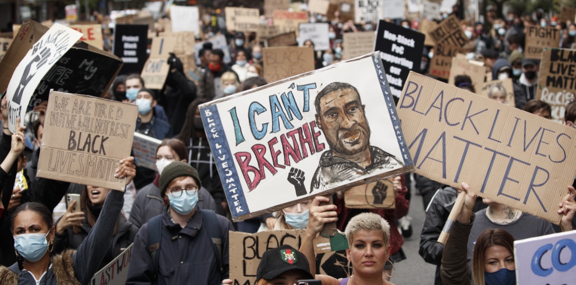 People take part in a Black Lives Matter protest rally in Manchester, in memory of George Floyd who was killed on May 25 while in police custody in the US city of Minneapolis