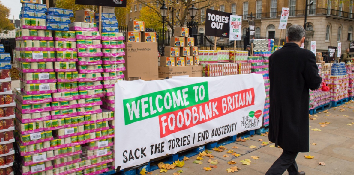 A People's Assembly protest where tins of food were stacked outside Downing Street 10 last year