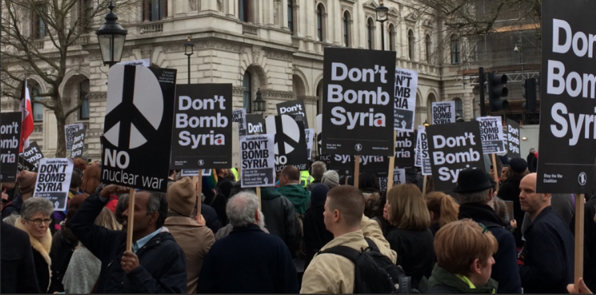 Protesters gather in Whitehall, London to protest the possible bombing of Syria Photo: @STWuk