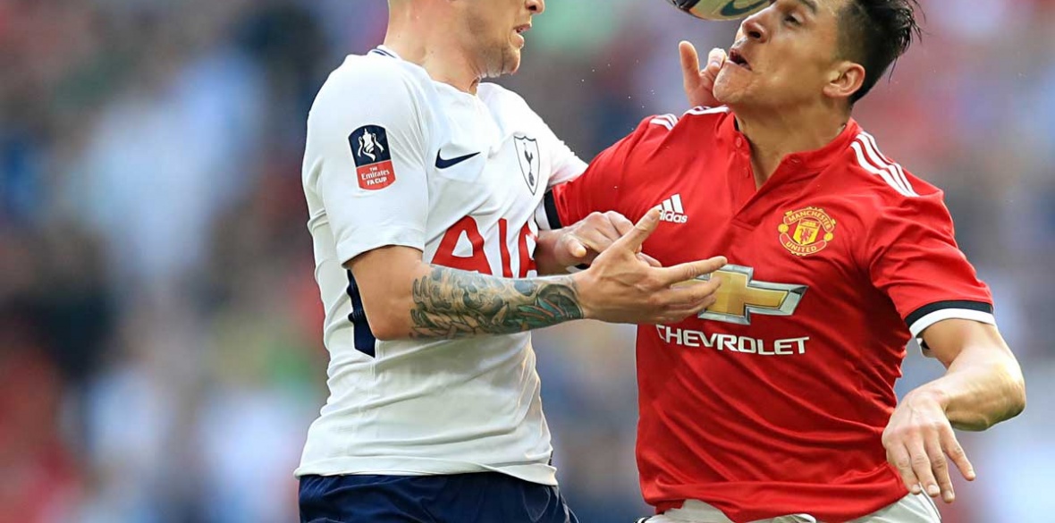 Tottenham Hotspur's Kieran Trippier (left) and Manchester United's Alexis Sanchez battle for the ball during the Emirates FA Cup semi-final match at Wembley Stadium, London.