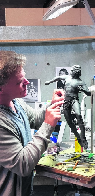 Sean Hedges-Quinn works on the model for his Kevin Beattie statue