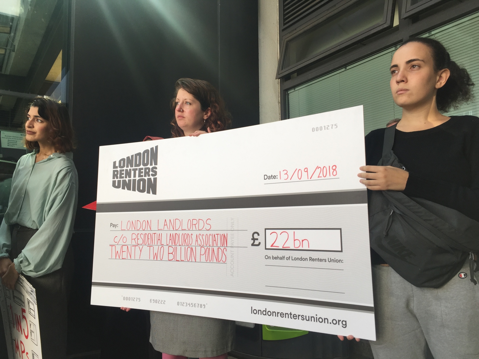 The London Renters Union present the RLA a giant cheque for £22 billion, representing London landlords’ total income from rent next year