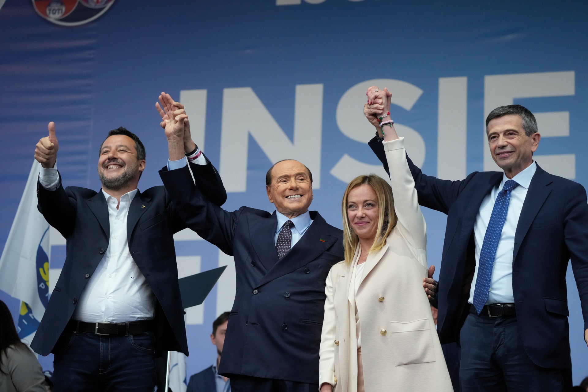  Silvio Berlusconi (centre left) welcomes Giorgia Meloni (centre right) into power, after decades of paving the way for the far-right's return to power in Italy