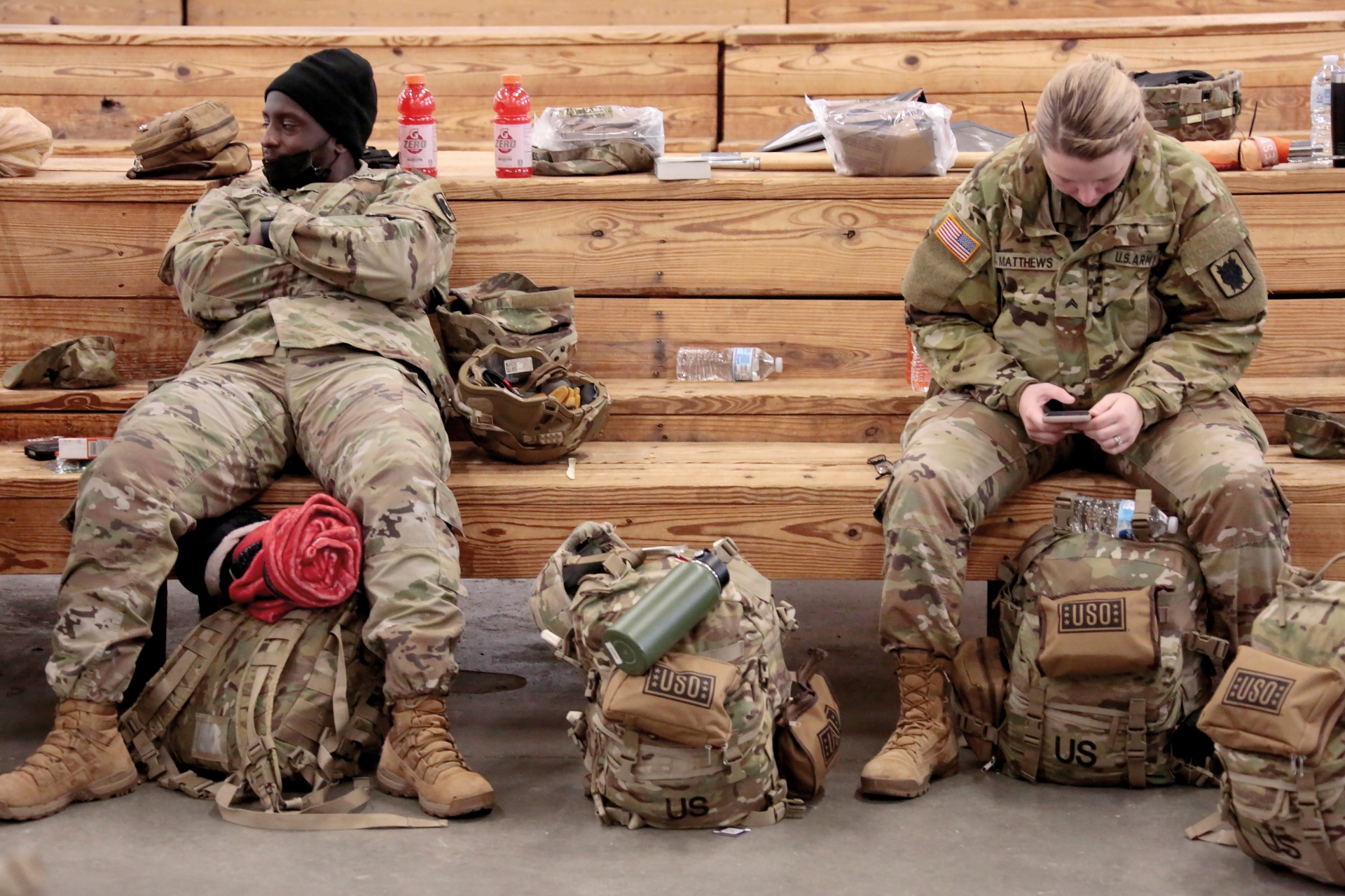 US Army soldiers from the 18th Airborne Division sit in the staging area as they wait to board a C-17 aircraft to deploy to Europe from Fort Bragg, February 3, 2022.