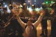 Anti-government protesters confront a line of police during 