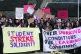 University staff are joined by politicians and students whil