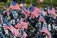 Protesters wave US flags during a rally outside the US consu