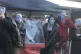 Members of Stroud Red Shed wear masks to symbolise the facel