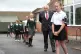 Prime Minister Boris Johnson waits in line in the playground