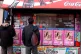 Migrant workers look for work in the window of a newsagent�
