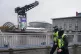 Police officers walk past the venue that will host Cop26 in 