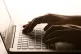 A person a laptop keyboard