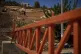 A Palestinian man pushes a wheelbarrow past a closed gate set up by Israeli authorities that blocks an entrance to the West Bank village of Sinjil, Tuesday, Sept. 30, 2025