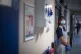 A support worker stands in a corridor as the first patients are admitted to the NHS Seacole Centre at Headley Court, Surrey, May 2020