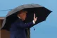 President Donald Trump waves from the stairs of Air Force One as he boards upon his arrival at Joint Base Andrews, Md., October 12, 2025, as he travels to the Middle East