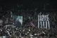 Fans hold a poster of Newcastle's head coach Eddie Howe during a Premier League soccer match between Newcastle United and Manchester City in Newcastle, England, November 22, 2025