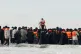 People thought to be migrants boarding a small boat in Gravelines, France, November 6, 2025
