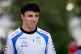 Racing Bulls driver Isack Hadjar of France walks through the paddock at the Lusail International Circuit ahead of the Qatar Formula One Grand Prix, in Lusail, Qatar, Thursday, Nov. 27, 2025