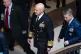 US Navy Admiral Frank ‘Mitch’ Bradley (centre) commander of the US Special Operations Command, and General Dan Caine, chairman of the Joint Chiefs of Staff (right) are escorted to a classified briefing, Dececmber 4, 2025