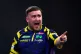 England's Luke Littler reacts during his match against England's Rob Cross on day sixteen of the World Darts Championship at the Alexandra Palace, London, December 29, 2025