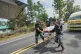 Thai rescue team members move a body into a vehicle after a Cambodian artillery strike in Sisaket province, December 14, 2025
