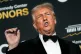 US President Donald Trump talks to the media while walking the red carpet before the 48th Kennedy Center Honours, at the John F Kennedy Center for the Performing Arts in Washington, December 7, 2025
