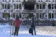 People look at a damaged private clinic after a Russian drone hit a hospital room killing a patient, in Kyiv, Ukraine, January 5, 2026