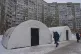 Residents pass by one of emergency tents where people can warm up following Russia's regular air attacks against the country's energy, that leave residents without power, water and heating in the dead of winter, in Kyiv, Ukraine, January 13, 2026
