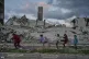 Palestinians girls play amid buildings destroyed by Israeli air and ground attacks in the Zeitoun neighbourhood of Gaza City, January 14, 2026