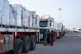 Trucks line up to enter the Egyptian gate of the Rafah crossing, heading for inspection by Israeli authorities before entering the Gaza Strip, January 27, 2026