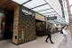 People walk out of an Amazon Go store in Seattle, March 4, 2020
