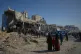 Palestinians search for bodies and survivors from the rubble of a police station after it was targeted by an Israeli army strike in Gaza City, January 31, 2026