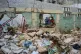 Children ride a merry-go-round on a playground surrounded by trash in Old Havana, Cuba, February 7, 2026