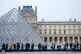 People wait for the Louvre museum to open as employees at the Louvre Museum vote to extend a strike that has disrupted operations at the world's most visited museum, Dec. 18, 2025 in Paris
