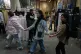 Women walk at Tehran's historic Grand Bazaar, Iran, Monday, Feb. 23, 2026
