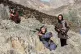 Afghan Taliban soldiers look toward the Pakistani side on the Afghan side of the Torkham border crossing with Pakistan in Torkham, Afghanistan, February 27, 2026