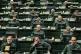 In this handout photo released by the Islamic Consultative Assembly News Agency (ICANA) Iranian lawmakers attend a session of parliament as they wear the Revolutionary Guard's uniform, in Tehran, Iran, February 1, 2026. Photo: Hamed Malekpour/ICANA via AP
