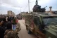 Kurdish-led Syrian Democratic Forces (SDF) combatants welcome the arrival of a convoy Syria's Interior Ministry security forces, deployed under an agreement aimed at stabilizing a ceasefire, in Qamishli, eastern Syria, February 3, 2026