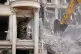 Rescue workers and first responders work at a residential building hit in an earlier US-Israeli strike in Tehran, Iran, March 23, 2026