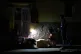 Street vendors chat during a blackout in Havana, March 16, 2026