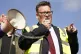 Labour MP for Kingston upon Hull East, Karl Turner, speaks to protesters outside the Port of Hull, East Yorkshire, March 18, 2022