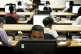 Workers at one of the 19 National Pandemic Flu Service call centres answer calls from people concerned about swine flu, London July 2009