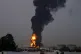 Fire and plumes of smoke rises after a drone struck a fuel tank forcing the temporary suspension of flights near Dubai International Airport, in United Arab Emirates, early March 16, 2026